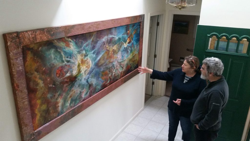 Director of the Vatican Observatory, Brother Guy Consolmagno, with Jill Nichols and her painting, 'Phi'.